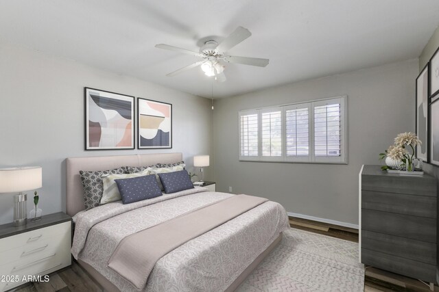 bedroom with wood-type flooring and ceiling fan