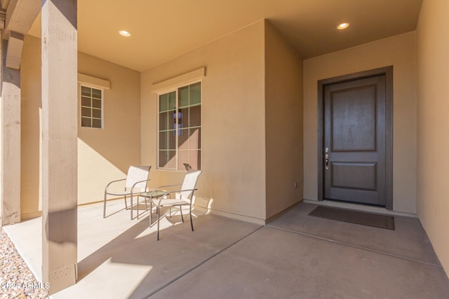 doorway to property featuring a patio