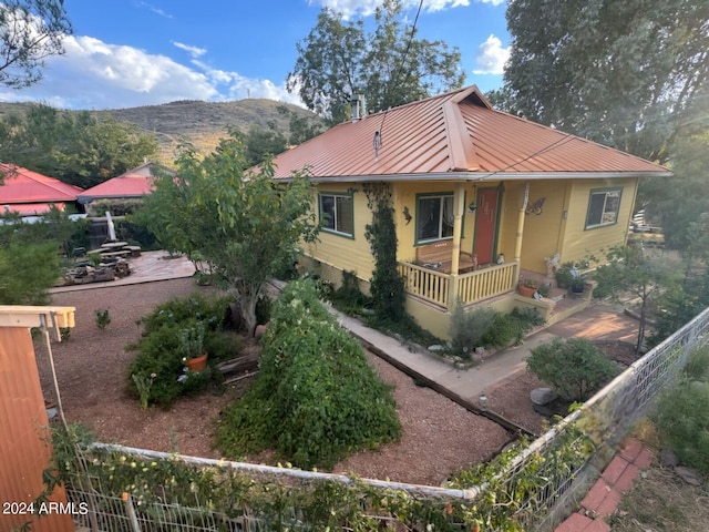 view of front of house featuring a mountain view and covered porch