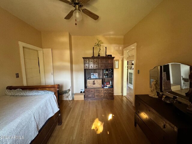 bedroom with hardwood / wood-style floors