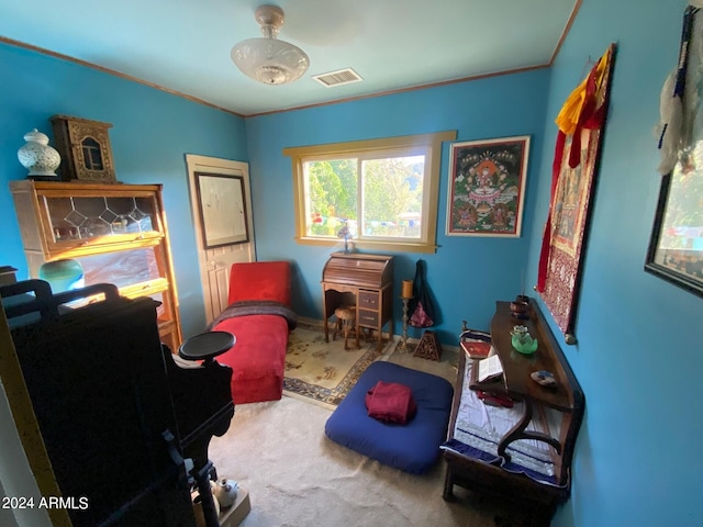 recreation room featuring ornamental molding and carpet