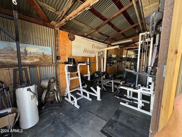 gym with vaulted ceiling