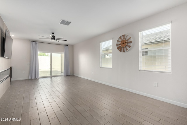 spare room with light hardwood / wood-style flooring and ceiling fan