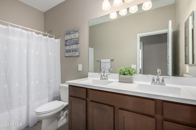 bathroom featuring vanity, toilet, and tile patterned floors