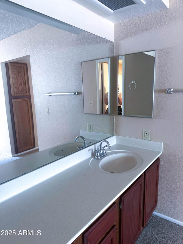 1075 E Chandler Blvd Unit 220, Chandler, AZ 85225 - bathroom with vanity and a textured wall