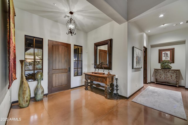 foyer with an inviting chandelier