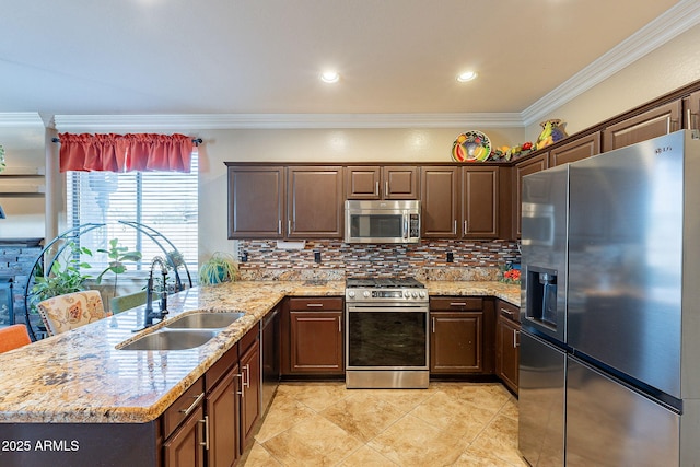 kitchen with ornamental molding, stainless steel appliances, sink, and dark brown cabinets