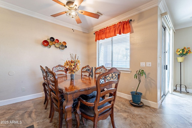 dining space featuring crown molding and ceiling fan