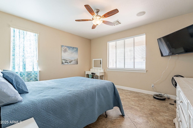 tiled bedroom with ceiling fan