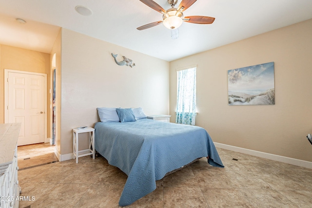 bedroom with ceiling fan and light tile patterned floors