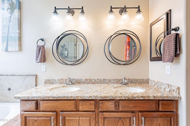 bathroom with vanity and a tub