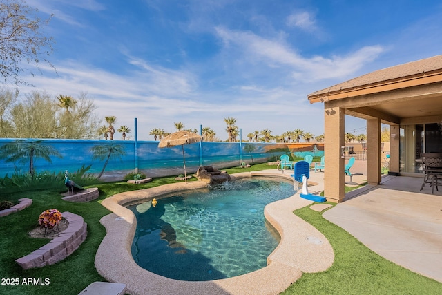 view of swimming pool with a patio