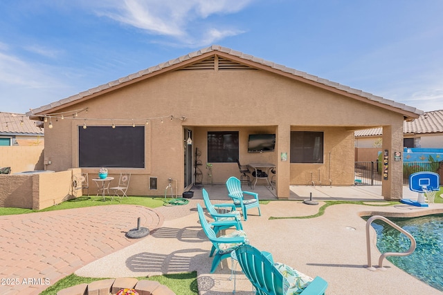 back of property featuring a patio area