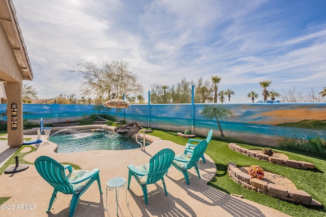 view of pool featuring pool water feature and a patio area