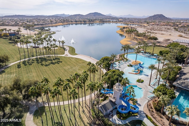 drone / aerial view featuring a water and mountain view