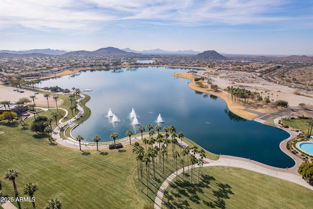 birds eye view of property with a water and mountain view