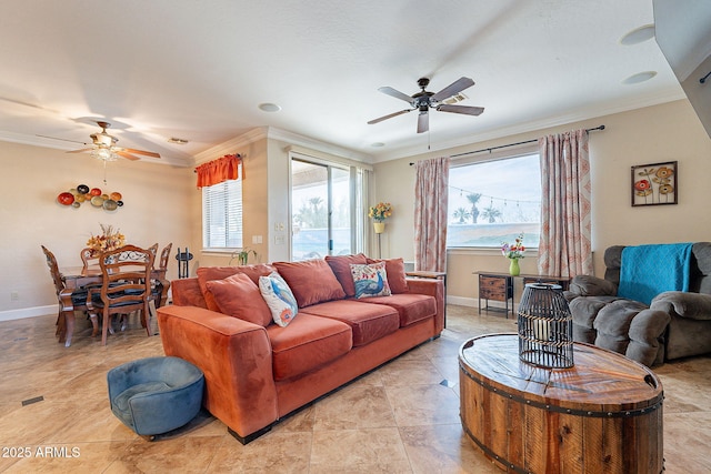 living room featuring crown molding and ceiling fan