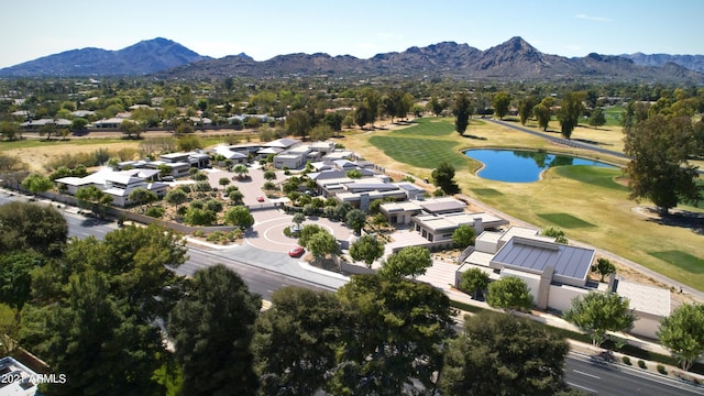 birds eye view of property featuring a water and mountain view