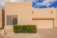 southwest-style home with a garage