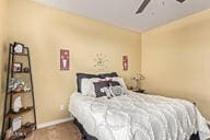 bedroom featuring carpet floors and ceiling fan