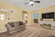 living room featuring ceiling fan