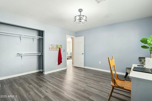 unfurnished office with dark wood-type flooring