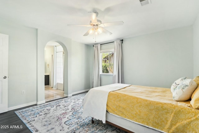 bedroom with wood-type flooring and ceiling fan