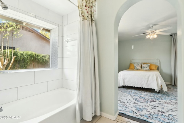 bathroom featuring tile patterned floors, shower / bath combination with curtain, and ceiling fan