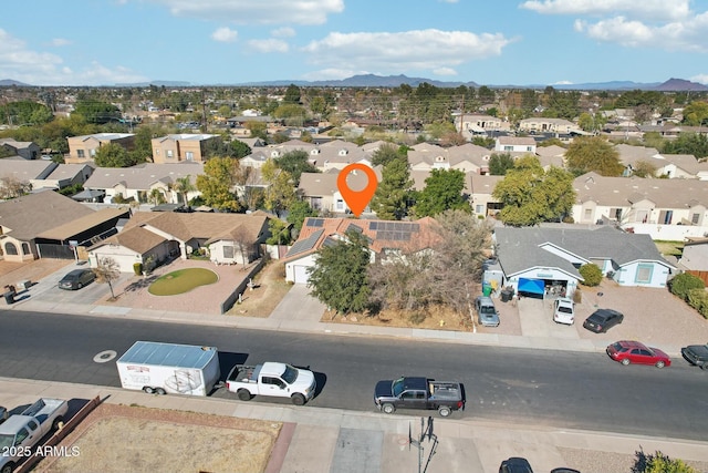 birds eye view of property with a mountain view