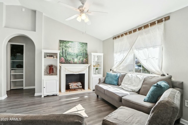 living room with wood-type flooring, lofted ceiling, and ceiling fan