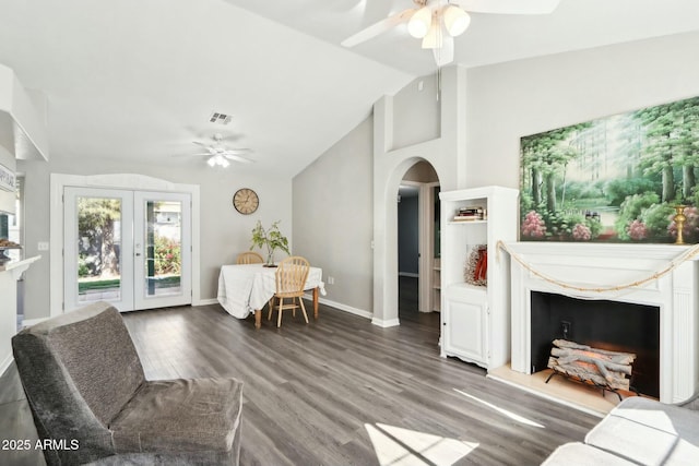 living room featuring hardwood / wood-style flooring, lofted ceiling, ceiling fan, and french doors