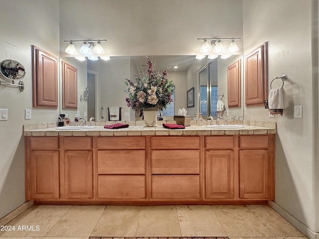 bathroom featuring tile patterned flooring and vanity