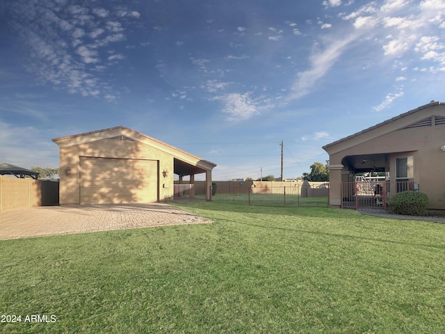 view of yard featuring an outbuilding and a garage