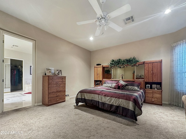 bedroom featuring ceiling fan and light colored carpet