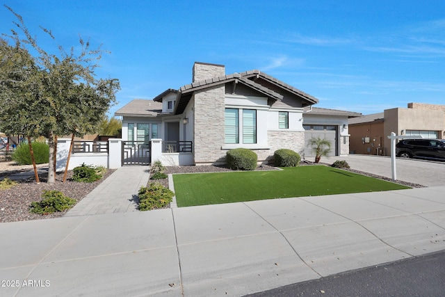 view of front of house with a garage and a front yard