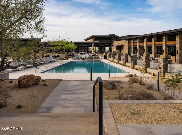 view of pool featuring a patio