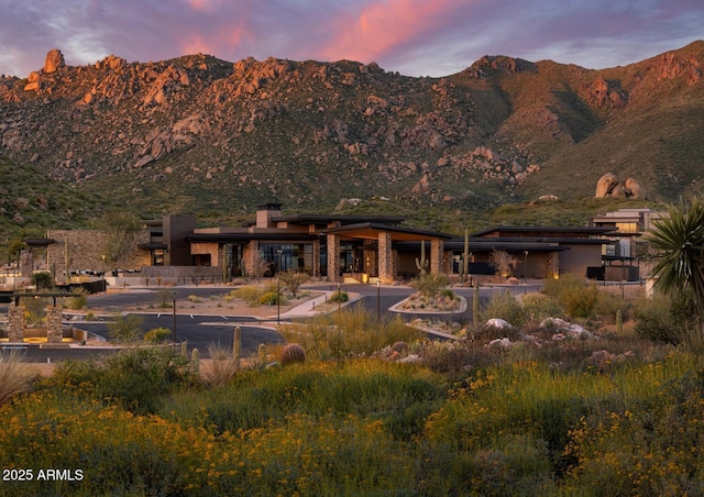 24642 N 123rd Pl Unit 114, Scottsdale, AZ 85255 - back of house at dusk with a mountain view