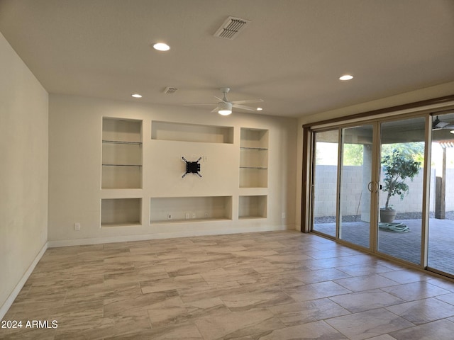 unfurnished living room featuring built in features and ceiling fan