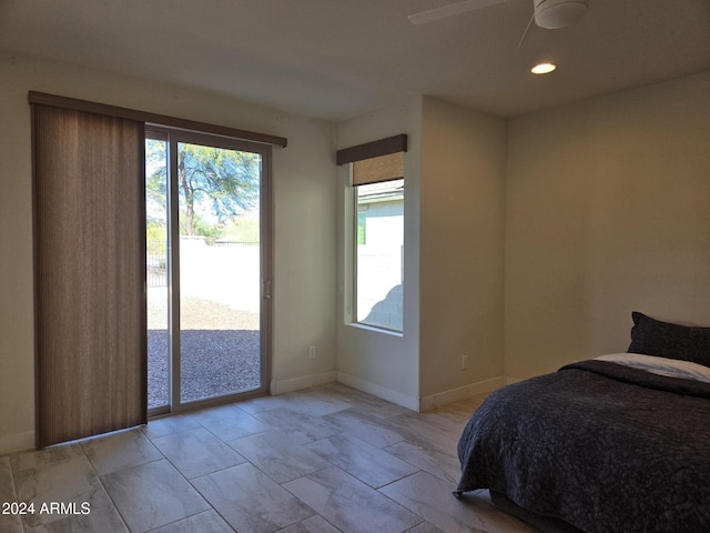 bedroom featuring ceiling fan and access to exterior