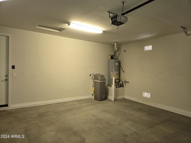 garage with a garage door opener and gas water heater