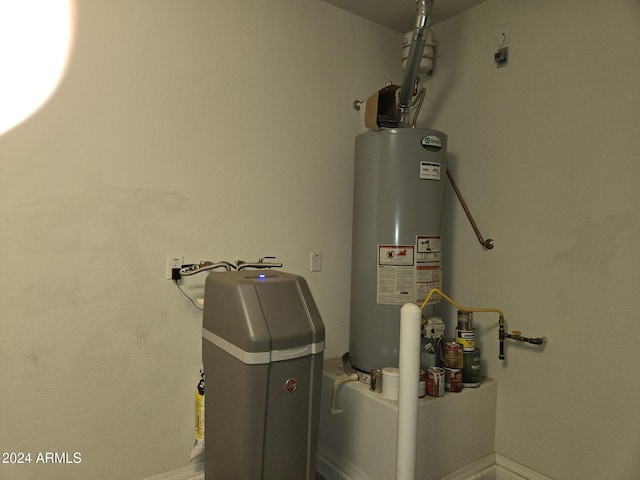 utility room featuring water heater