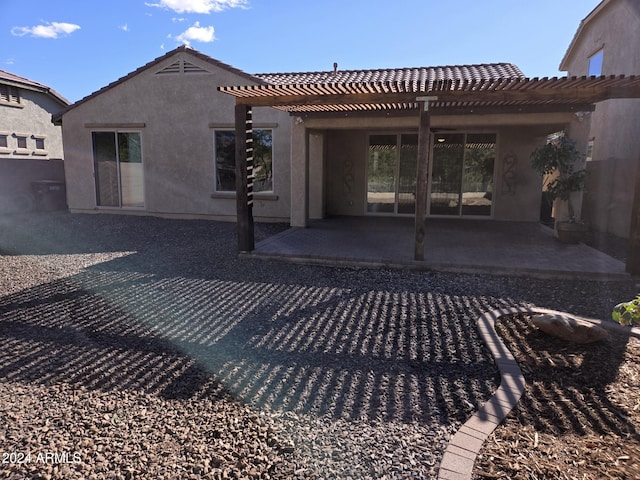 rear view of property featuring a patio area