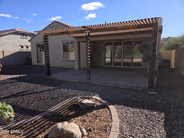 back of property with a patio