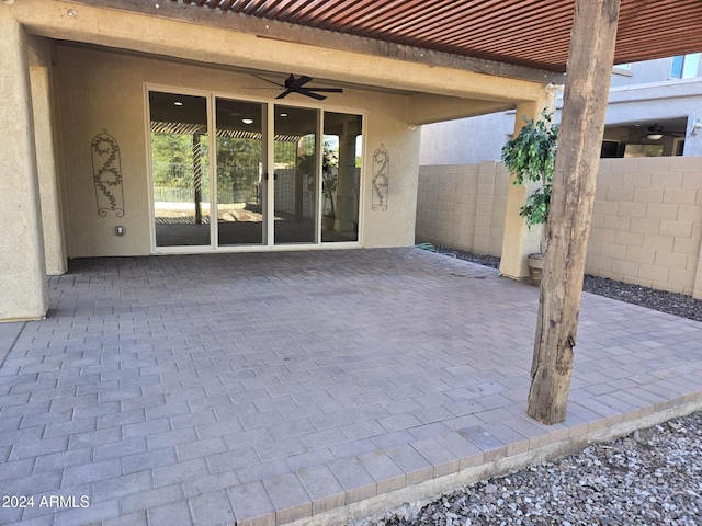 view of patio featuring ceiling fan