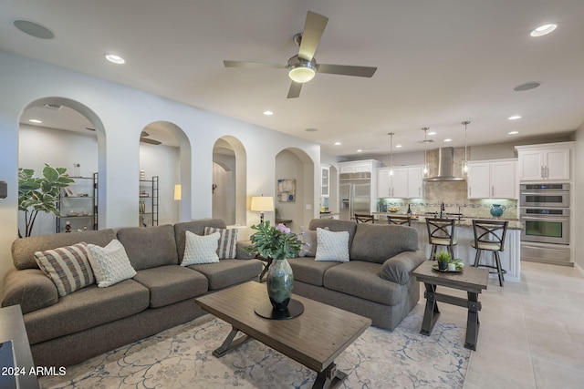 living room with sink and ceiling fan