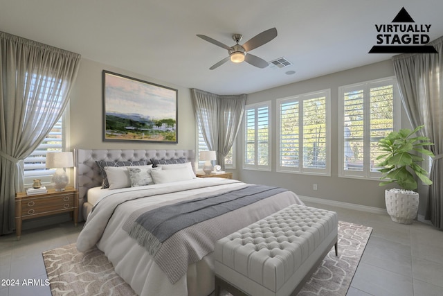 bedroom with multiple windows, ceiling fan, and light tile patterned flooring