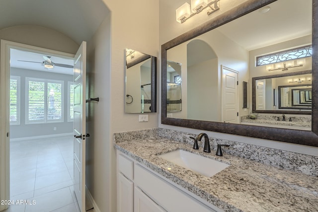 bathroom featuring tile patterned flooring, vanity, and ceiling fan