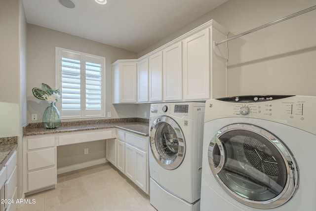 laundry area with cabinets, washing machine and clothes dryer, and light tile patterned floors