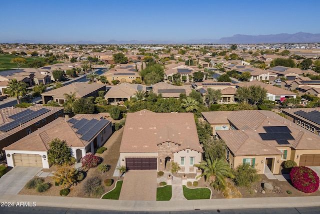 birds eye view of property with a mountain view