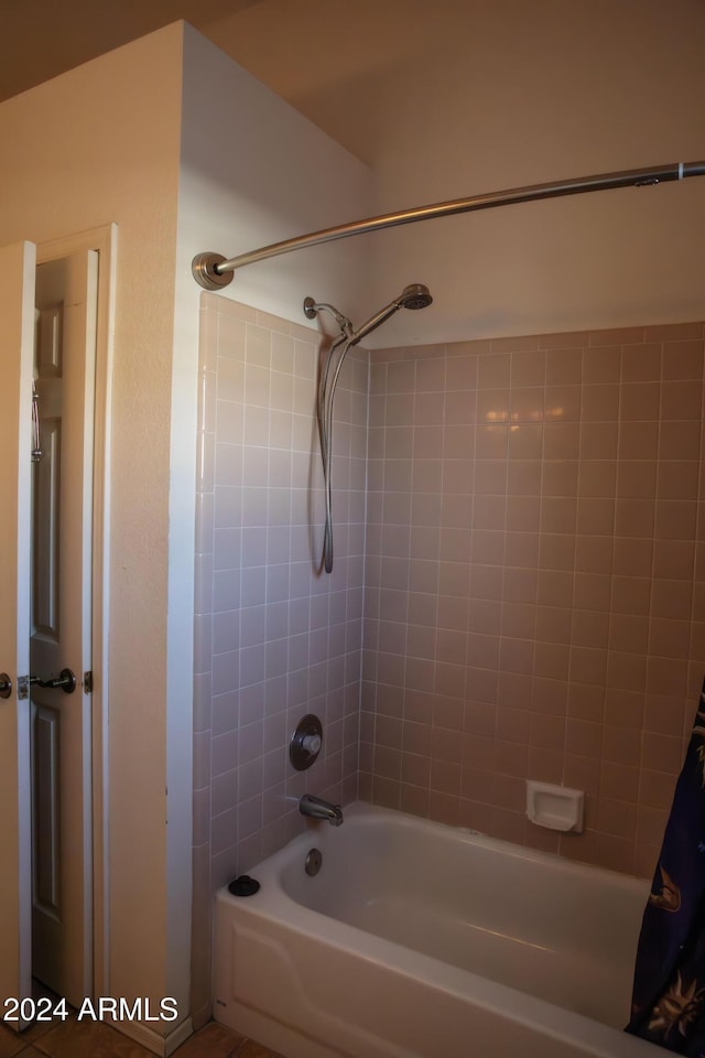 bathroom with shower / bath combination with curtain